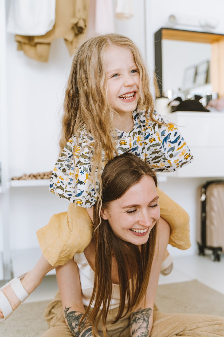 A parent lovingly holding their smiling child